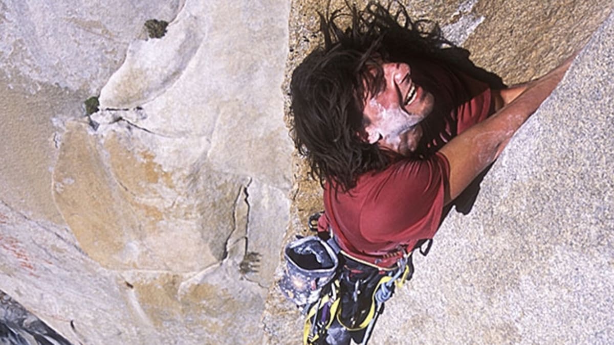 Man & woman sort rock climbing gear during early morning in mountains stock  photo