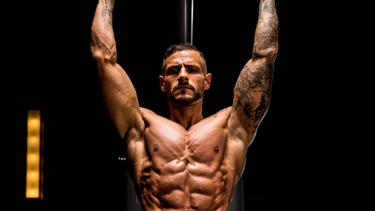 Male Bodybuilder Posing On Black Studio Background. Back View Of Strong Body  And Muscles, Low Key Stock Photo, Picture and Royalty Free Image. Image  102122612.