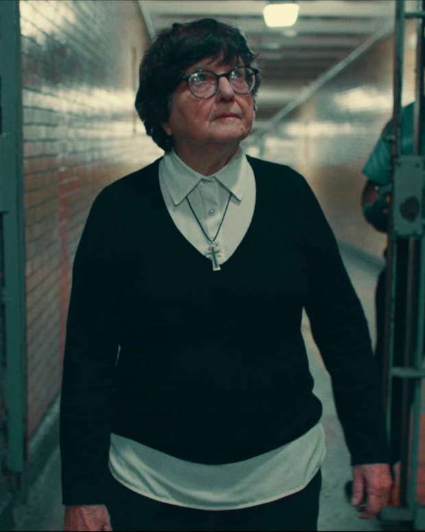 Sister Helen Prejean walks through a prison in Rebel Nun