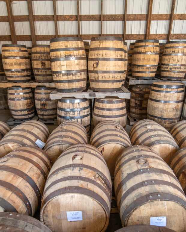 Whiskey Barrels in a Warehouse