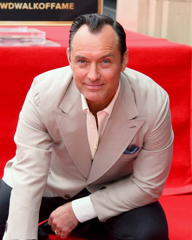 Jude Law receding hairline: The actor poses with his star during the Jude Law Star Ceremony on Hollywood Boulevard in Hollywood, California, on December 12, 2024.