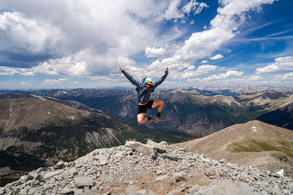 Dalton jumping with excitement after completing all 15 Sawatch 14ers in 17 days