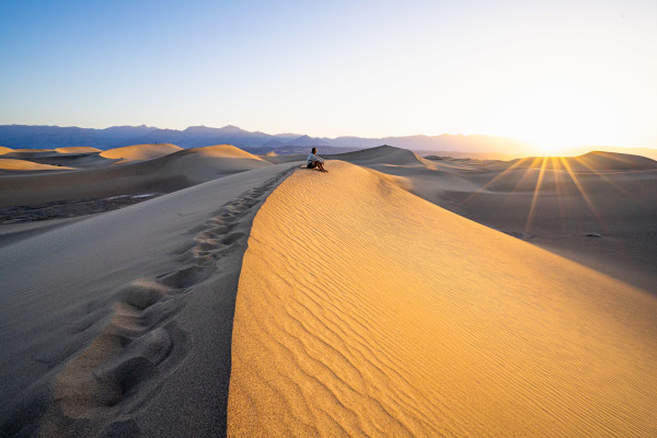 Watching sunrise from the sand dunes in Death Valley, CA