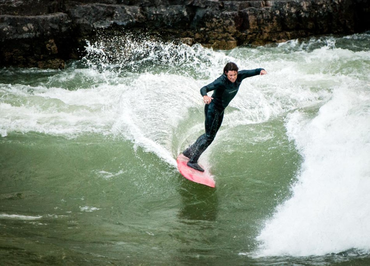 Snake deals river surfing