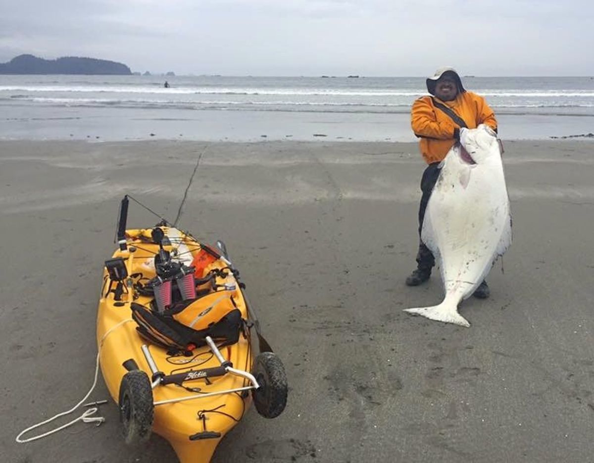 Kayak fisherman capsized by huge halibut but hangs on for record