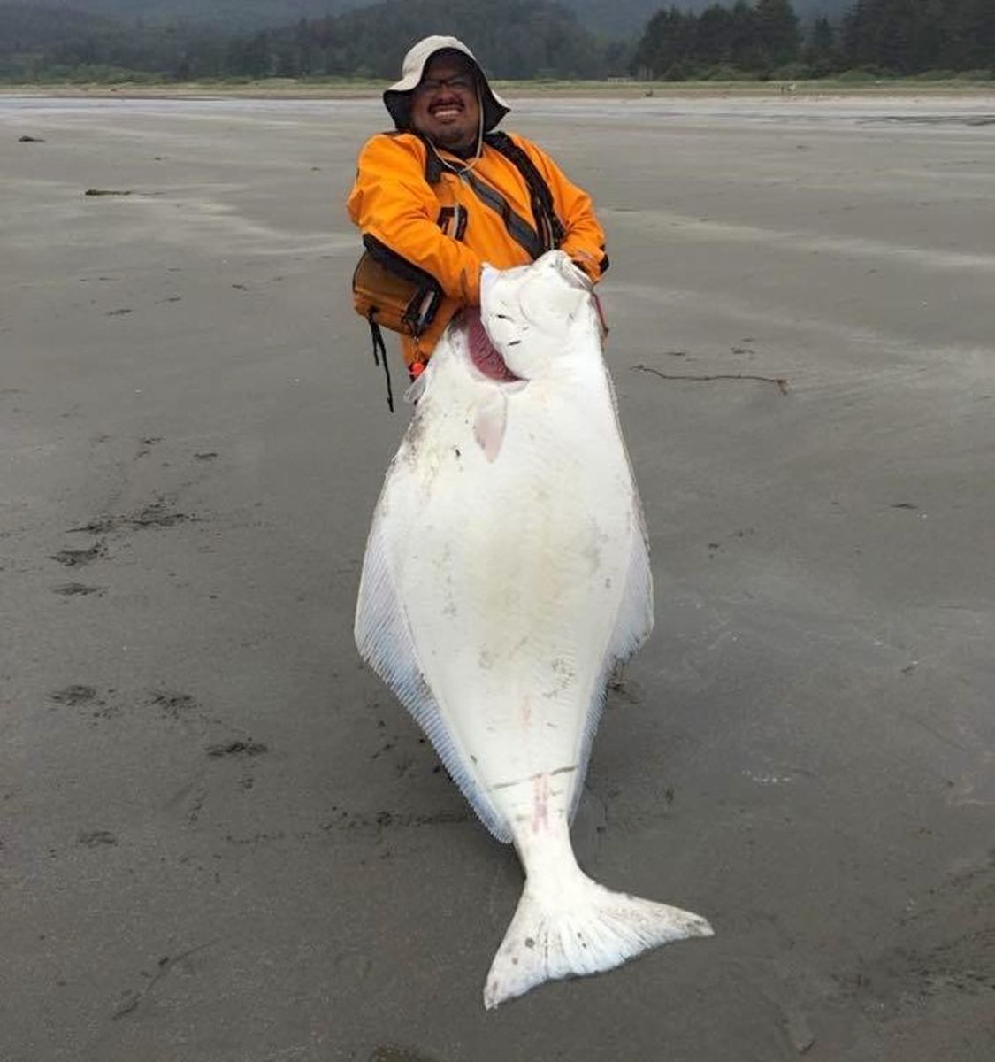 Kayak fisherman capsized by huge halibut but hangs on for record catch -  Men's Journal