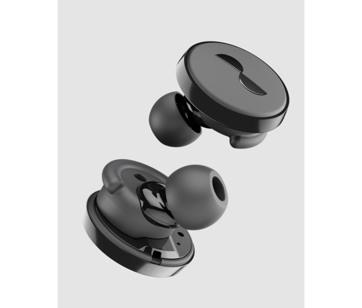 Black, disc-like earbuds on a gray background.