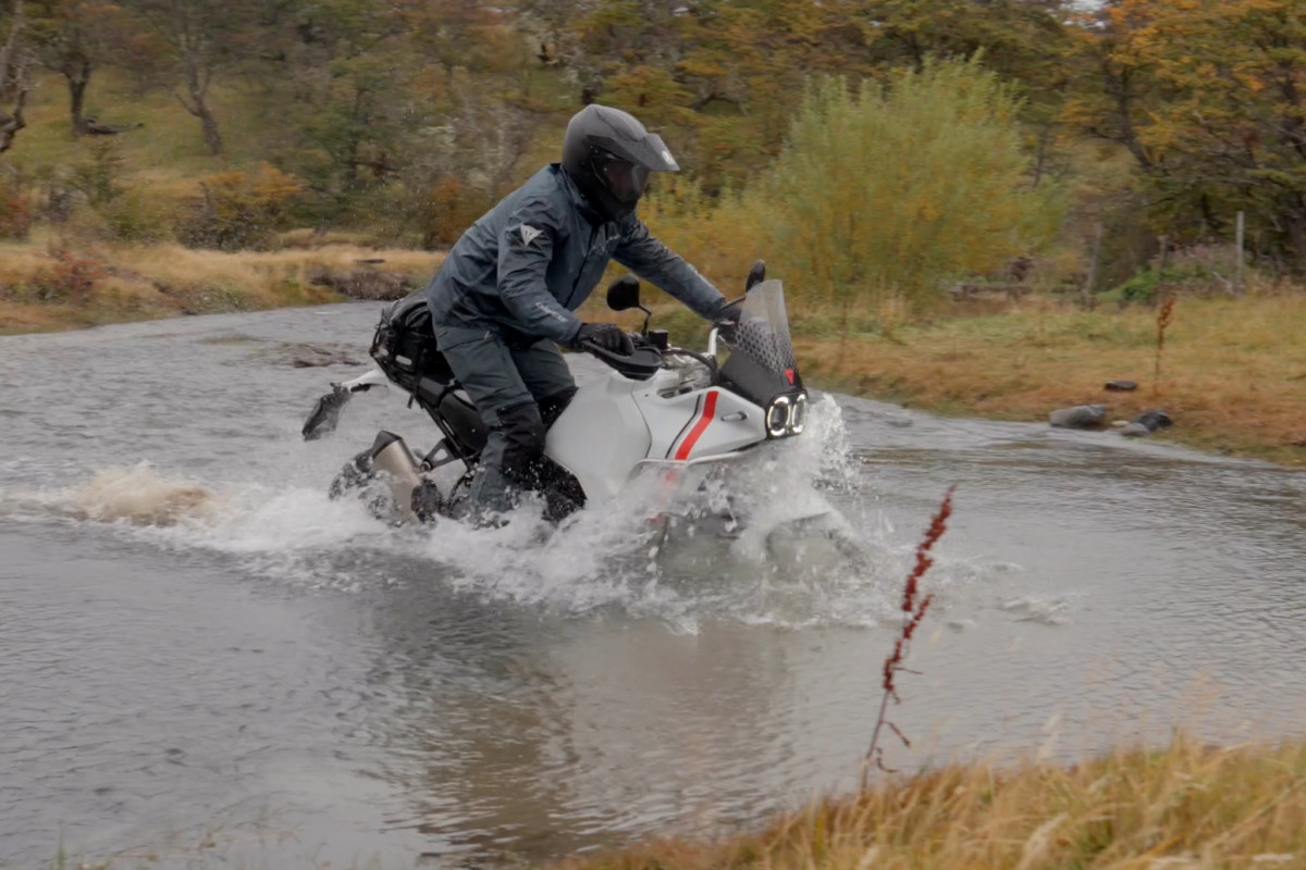 Crossing a creek on the Dainese Expedition Masters motorcycle tour