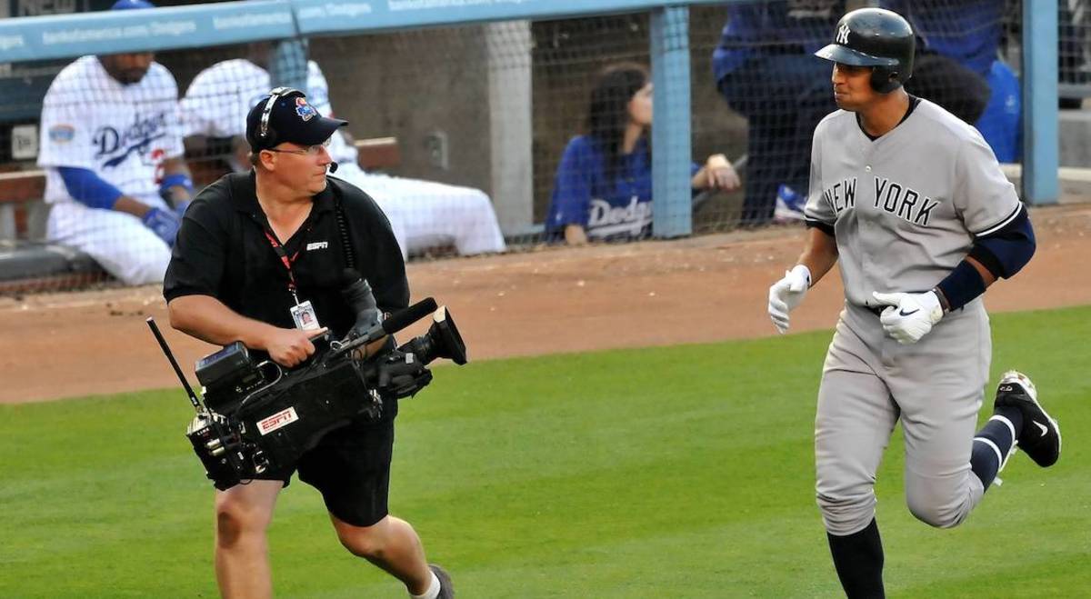 Photo: New York Yankees Alex Rodriguez reacts holding the MLB