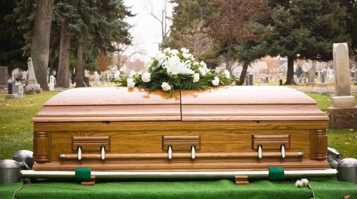 Stock photo of a coffin at a cemetery.