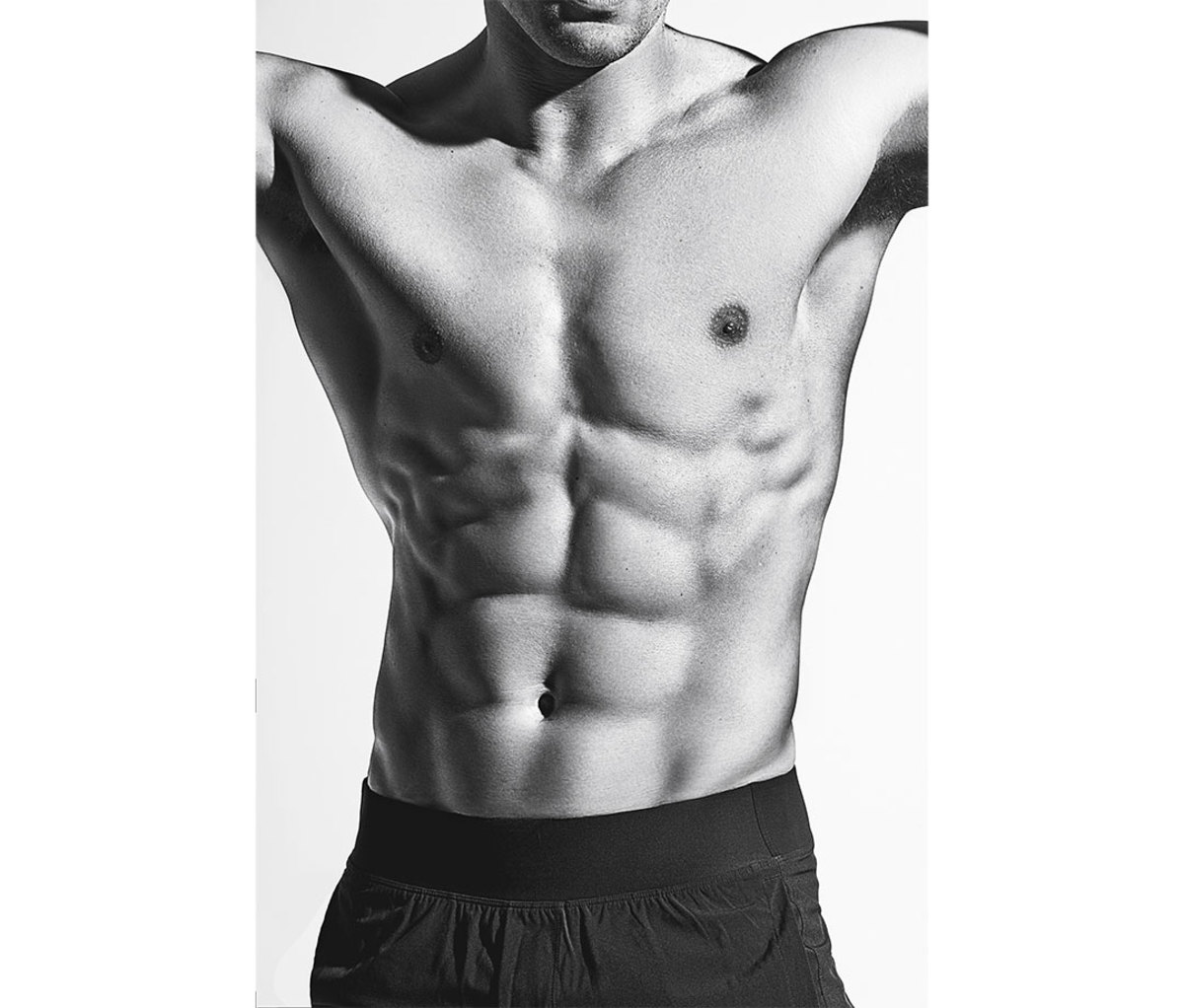 Black and white photo of man's six-pack abs