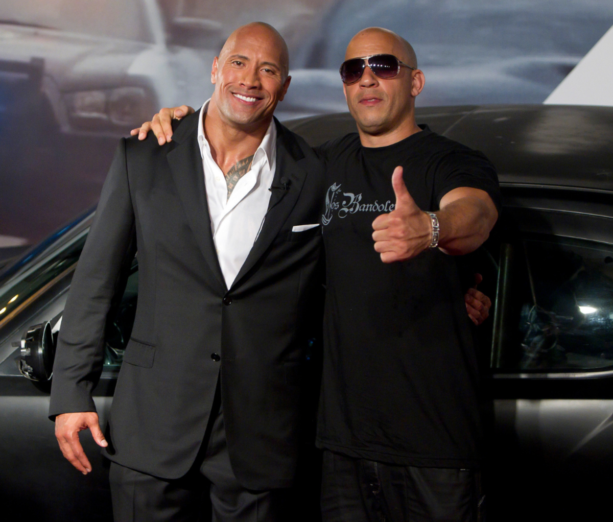 Best Vin Diesel Quotes: Dwayne Johnson (The Rock) and Vin Diesel (R) pose for photographers during the premiere of the movie "Fast and Furious 5" at Cinepolis Lagoon on April 15, 2011 in Rio de Janeiro, Brazil