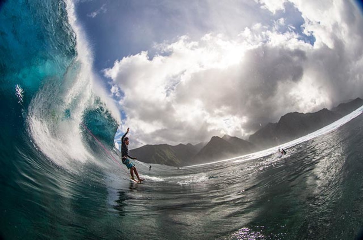 person flying off a surfboard into the waves