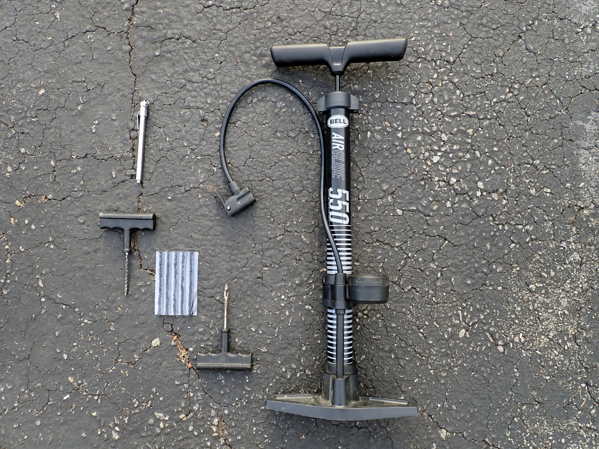 Tire pressure gauge, plug kit, pump.