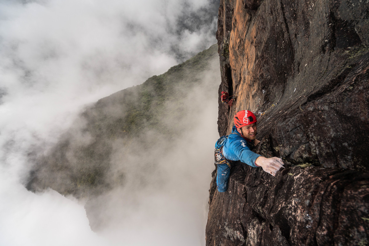 Houlding leading hard trad in the jungle