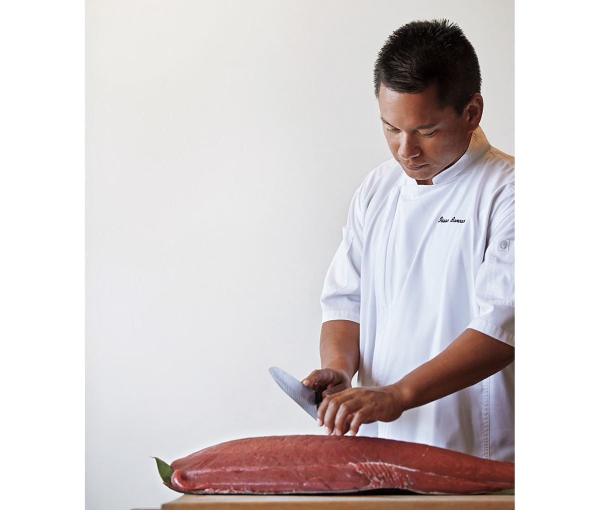 Preparing ahi in the kitchen at Ka'ana Kitchen.