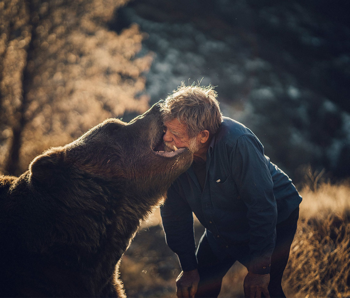 Doug Seus plays around with bear Little Bart