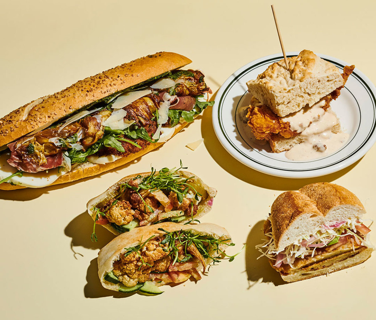 Clockwise from top left: The PFD, Nasty Chicken Biscuit, Papas y Masa Torta, and Cauliflower Shawarma Batbout