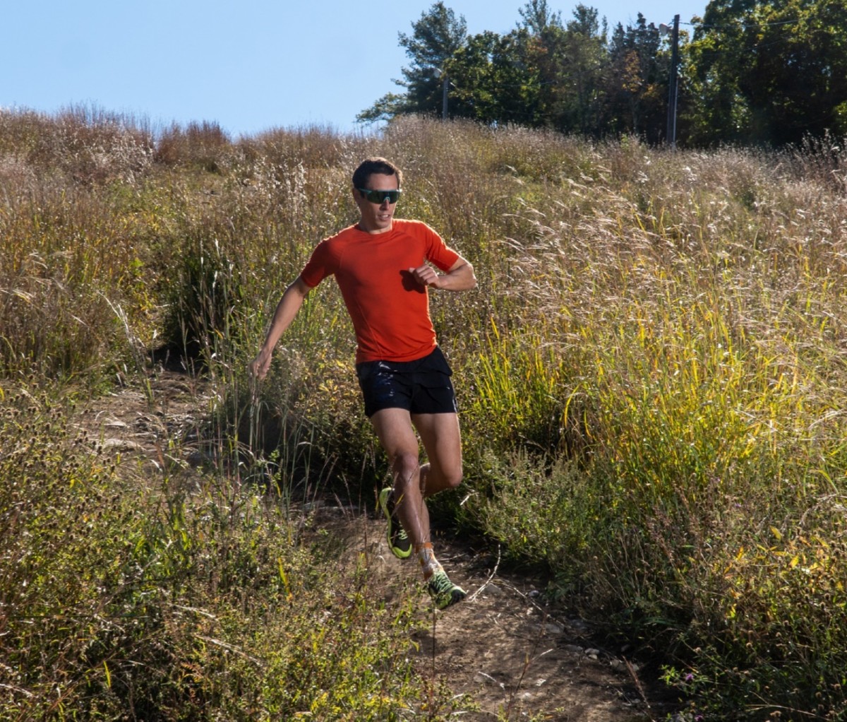 OCR athlete Ryan Kempson running down a hill at Blue Hills Ski resort in Canton, Massachusetts