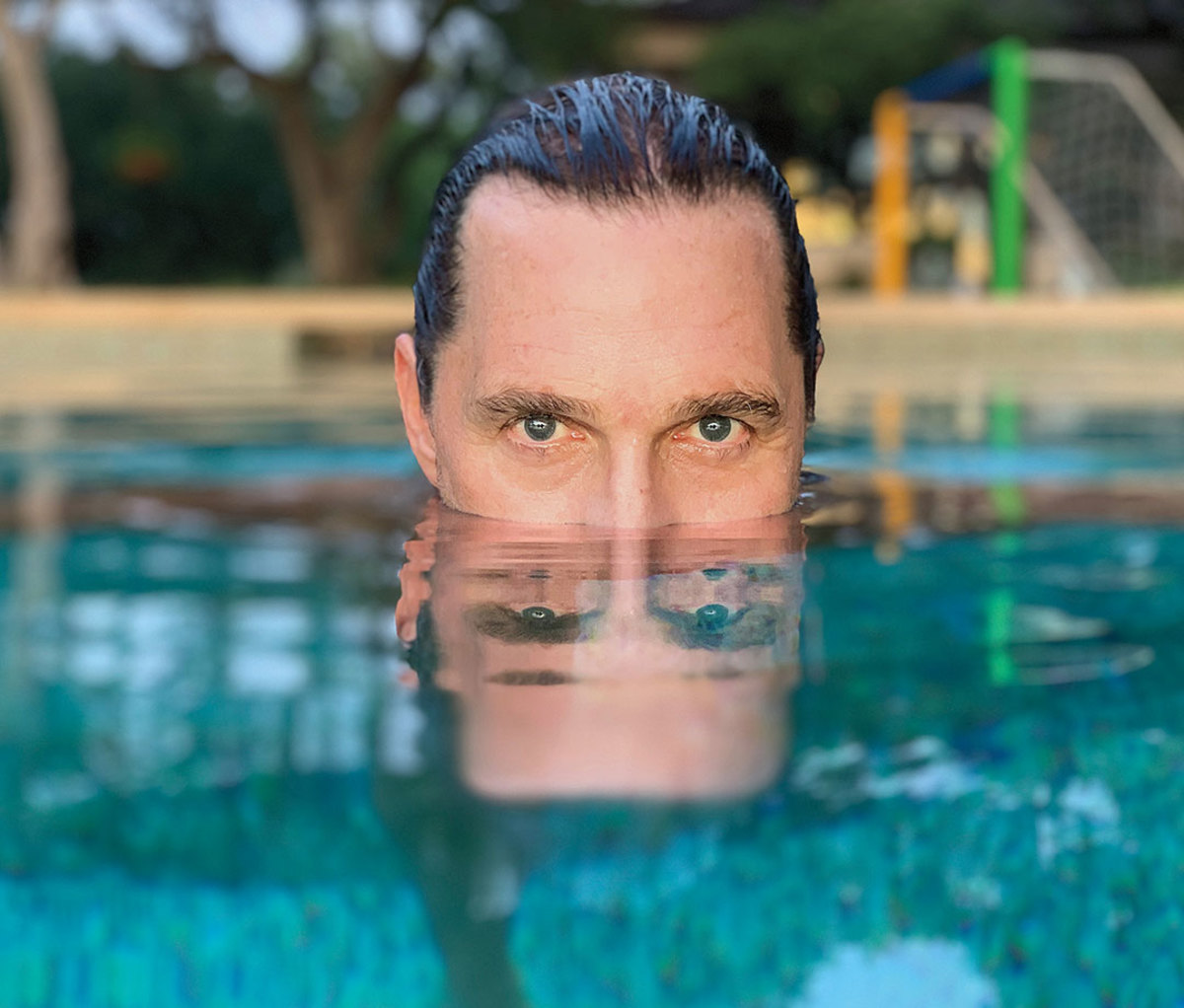 Matthew McConaughey half-submerged in pool