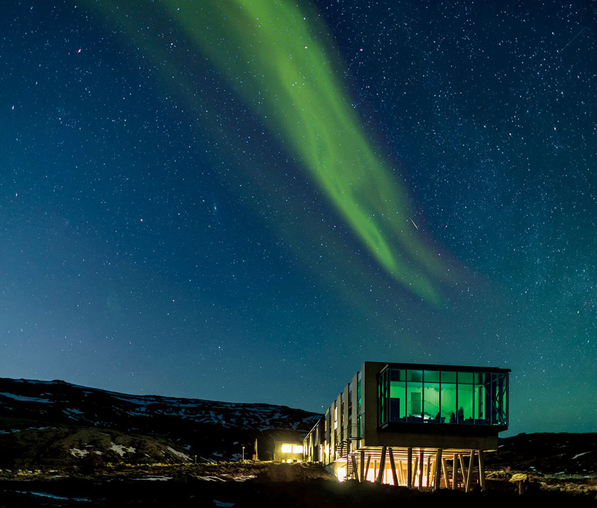 Iceland's Northern Lights Bar at night with aurora borealis overhead