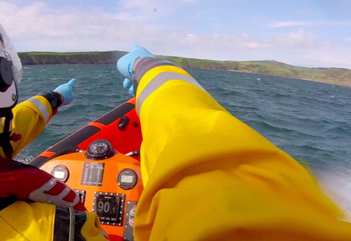 Coastguard lifeboat rescue crew zodiac