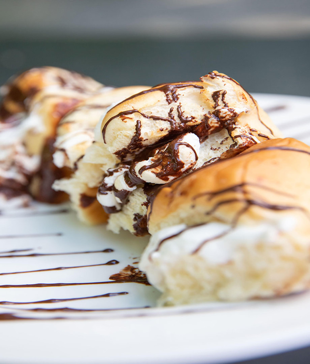 Upclose image of the Campfire Sticky Buns on a white plate