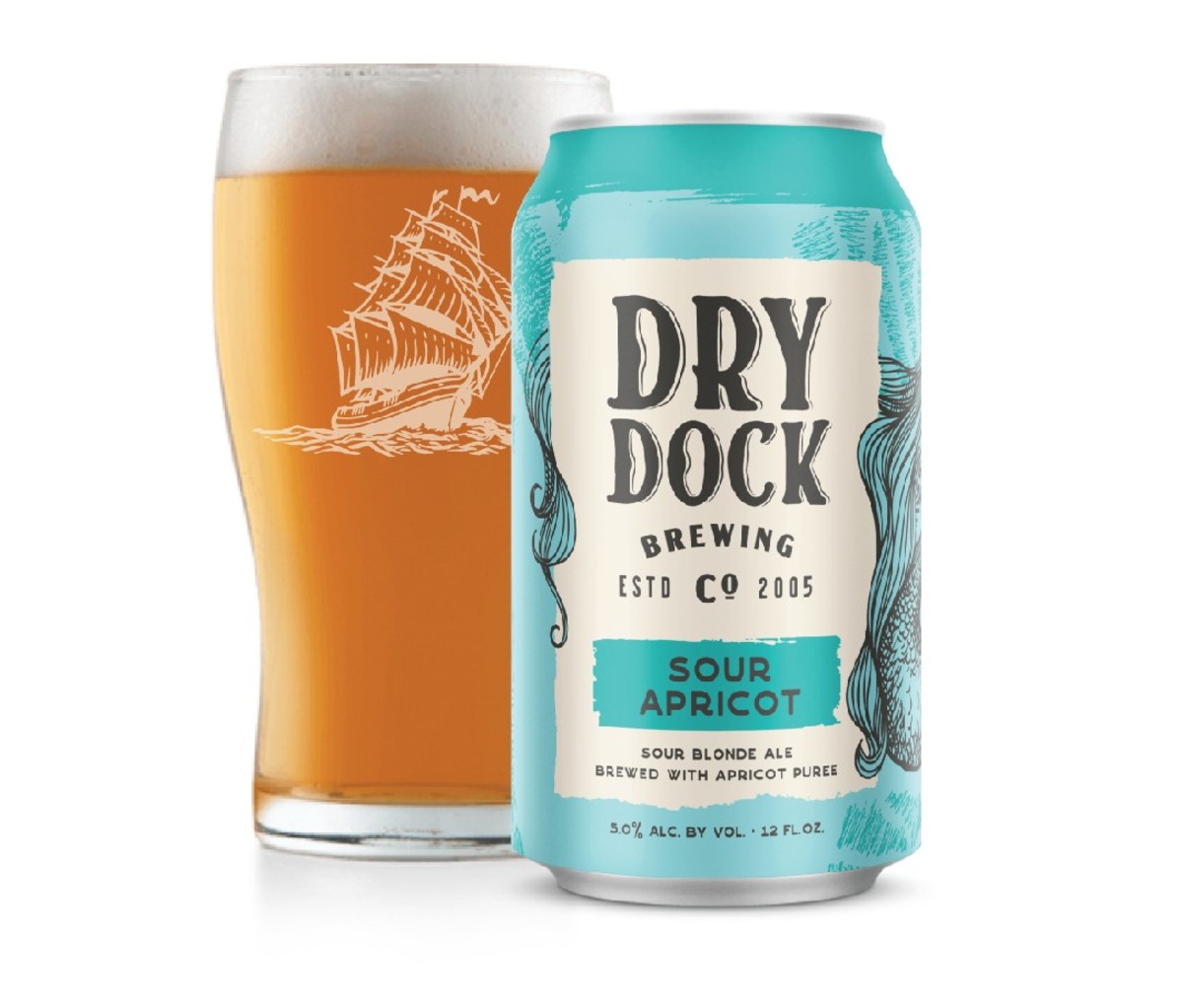 12 oz can and pint glass of Dry Dock Apricot Sour beer