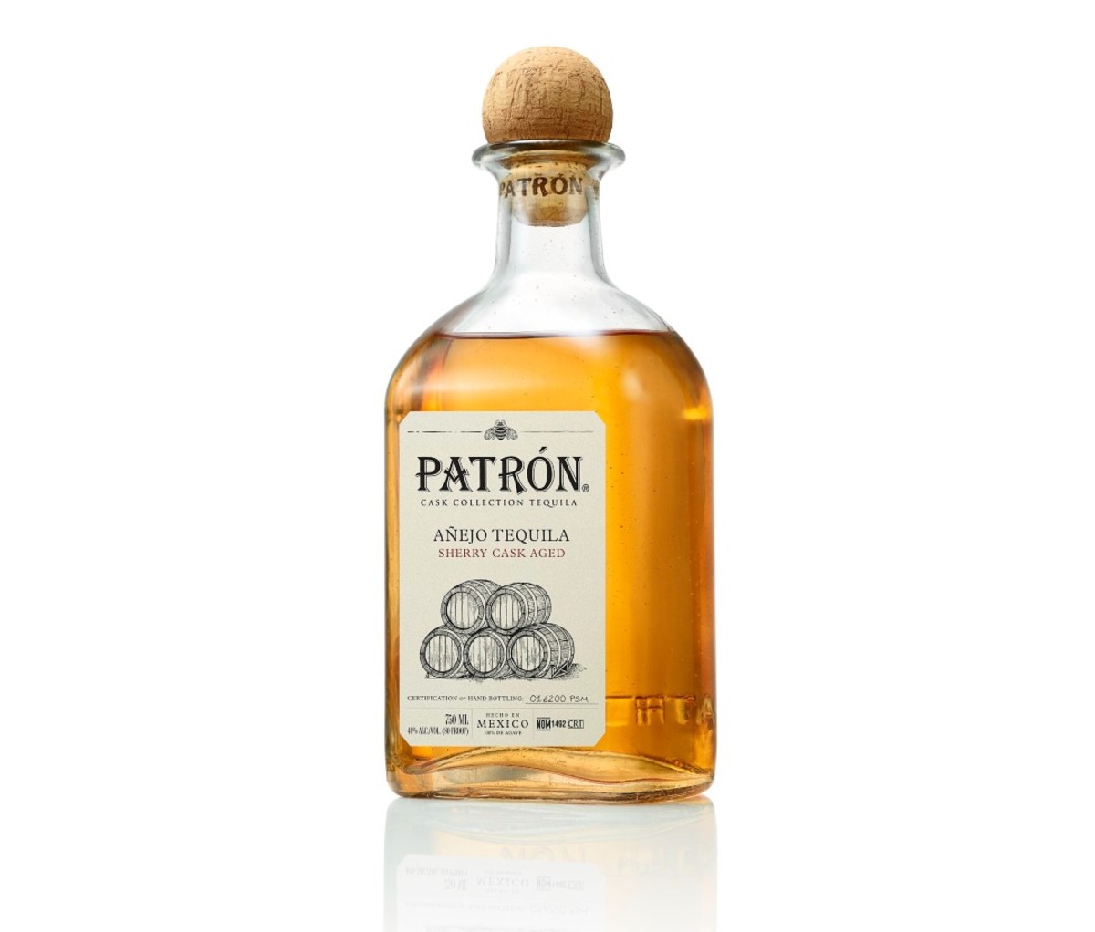 Bottle of Patrón Sherry Cask Aged Añejo Tequila on a brown table