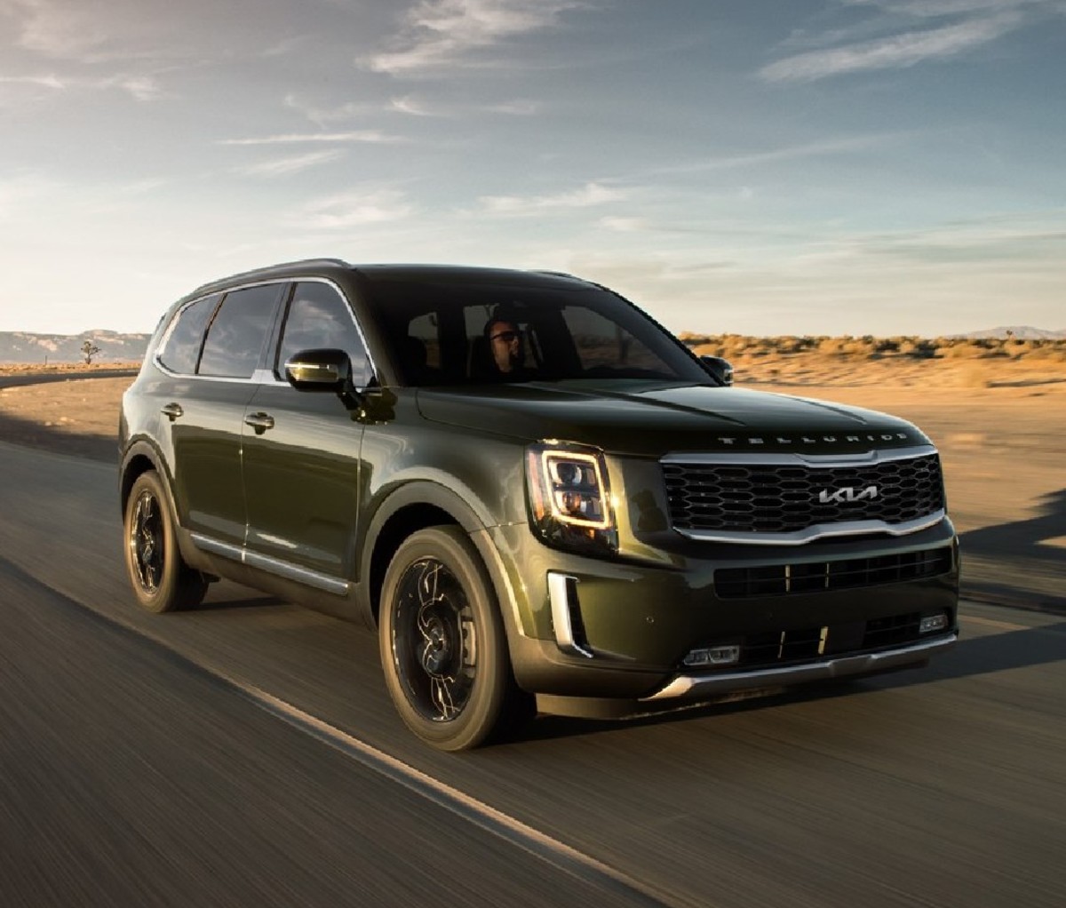 Dark green 2022 Kia Telluride on the road, front angle