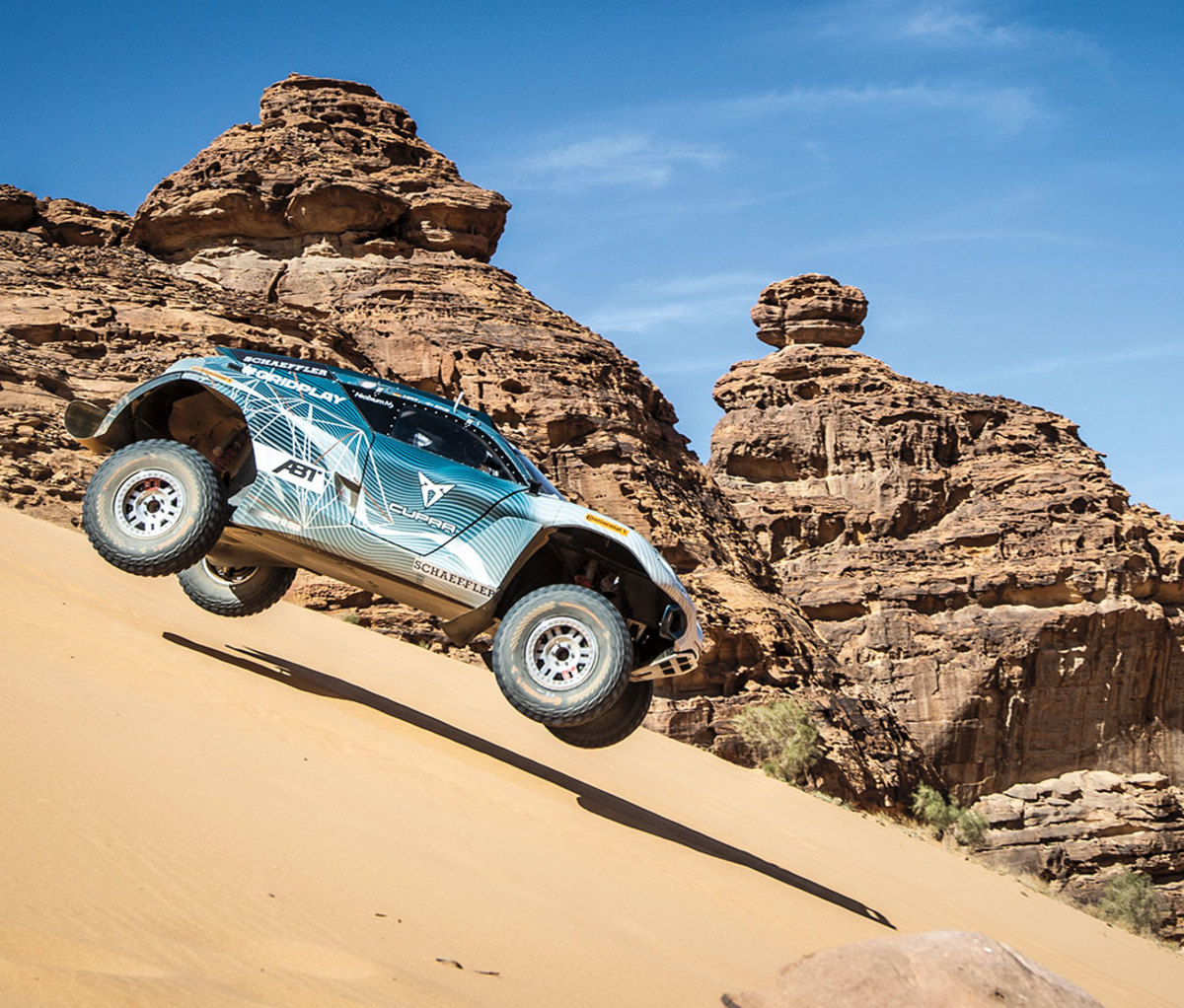 Off-roading vehicle driving through desert