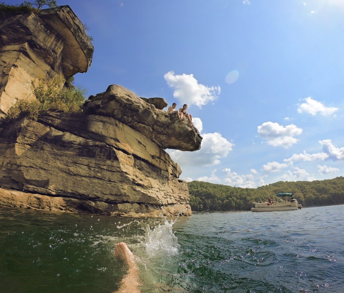 Swimming in lake with rocks nearby