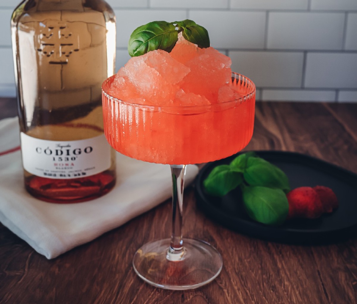 The Summer Friday Cocktail in a coupe glass on a wooden table