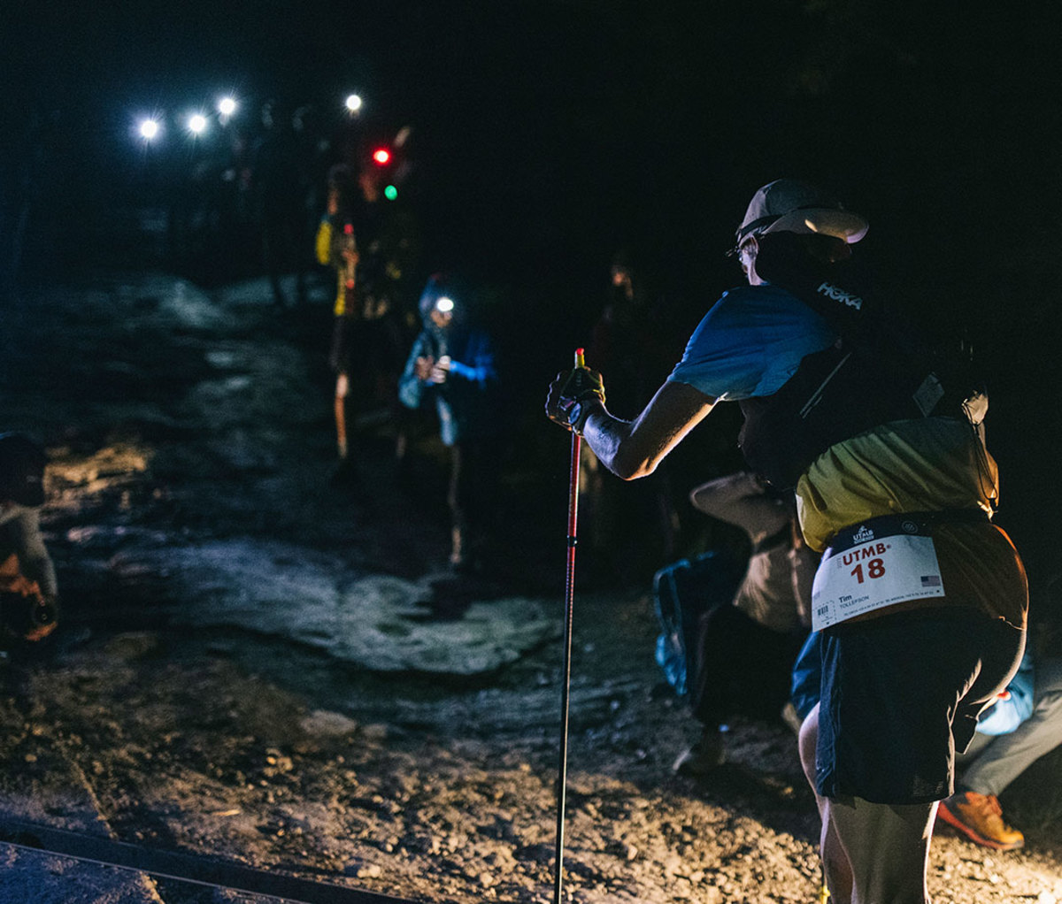 Ultrarunners climbing vertical with headlamps