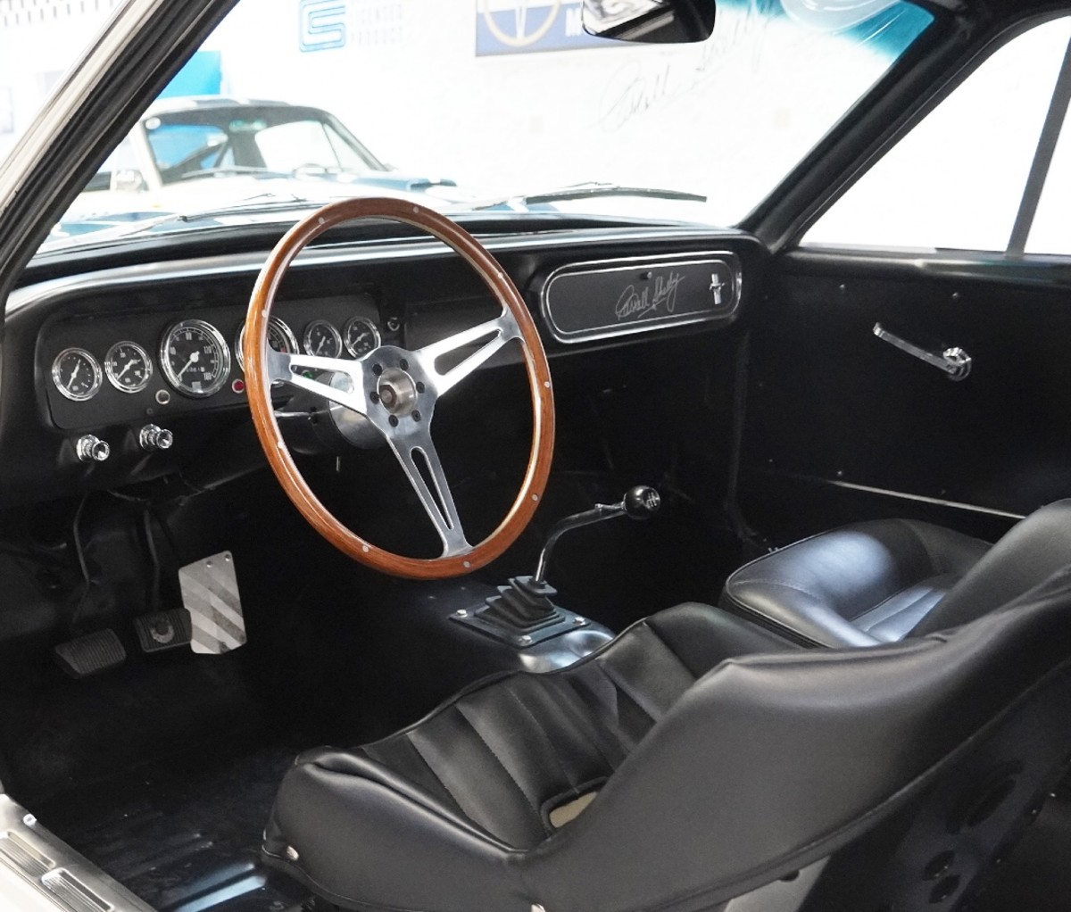 Interior of a vintage Ford Mustang.