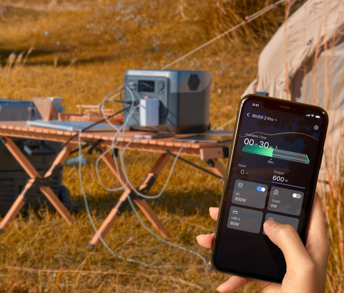 Hand holding smartphone with app opened to portable charger