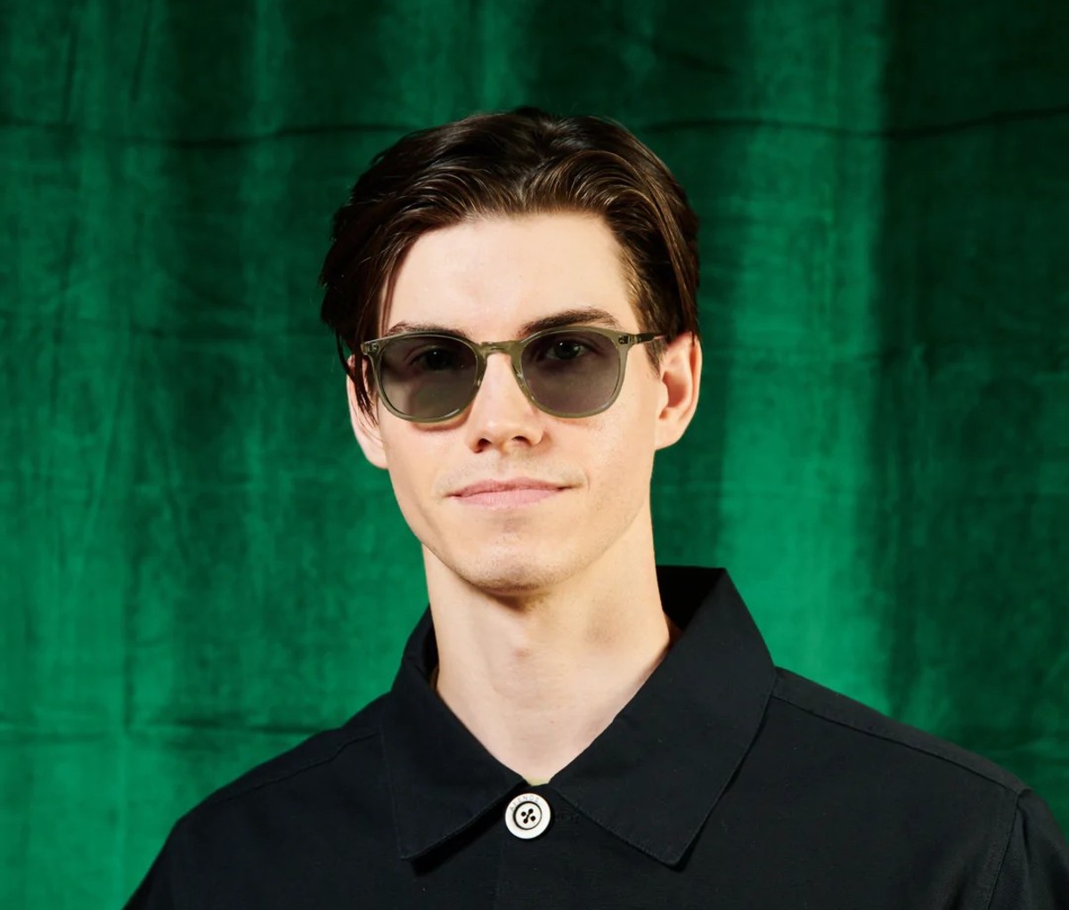 Caucasian model wearing sunglasses