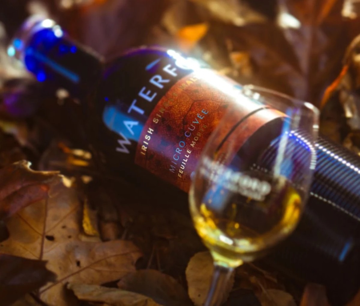 Bottle of Micro Cuvée: Hearth from Waterford Whisky nestled on leaves