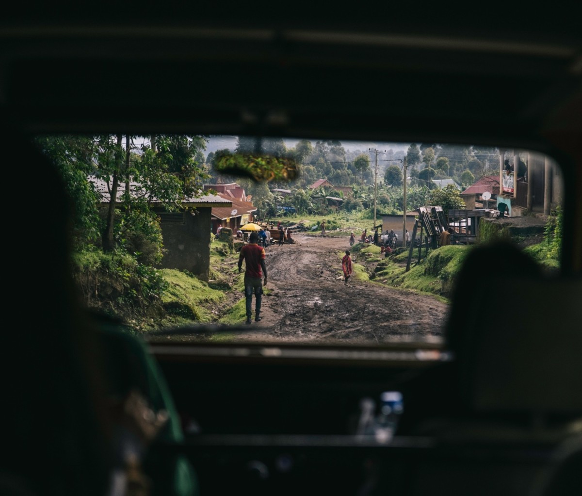 African village as seen through the back of a Land Rover