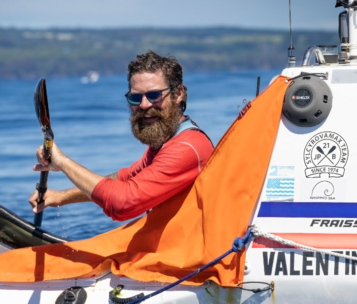 Cyril Derreumaux aboard kayak, paddling in the Pacific.