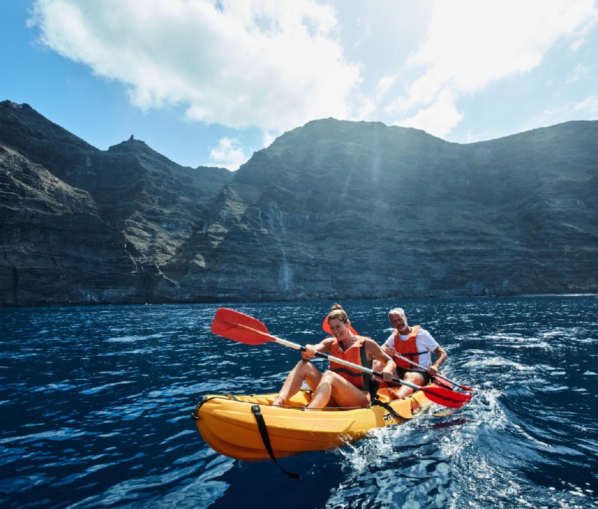 Two paddlers in an inflatable boat off the coast of Tenerife.