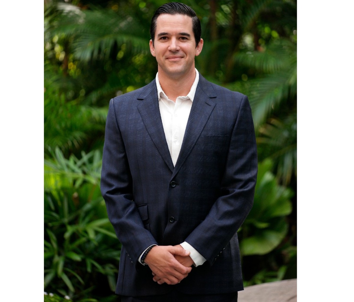 U.S. military veteran Andy Stumpf standing in a suit.