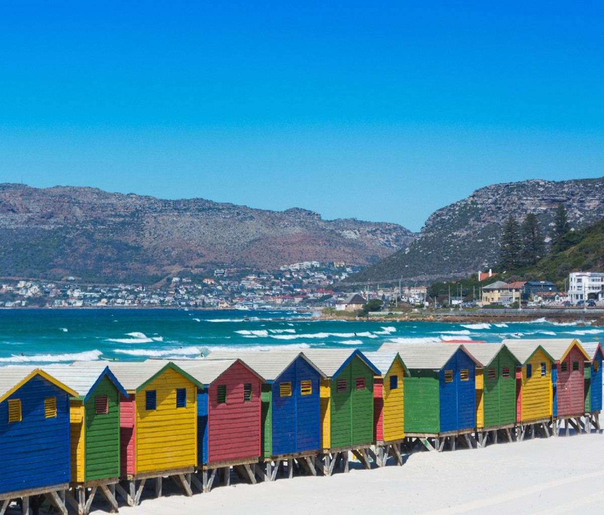 Colorful wooden beach huts on the beach at Muizenberg, Cape Town.