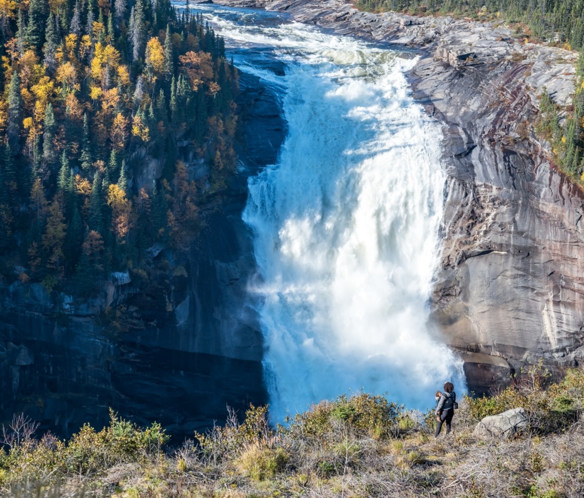 Churchill Falls with a person in the foreground. Trans-Labrador Highway