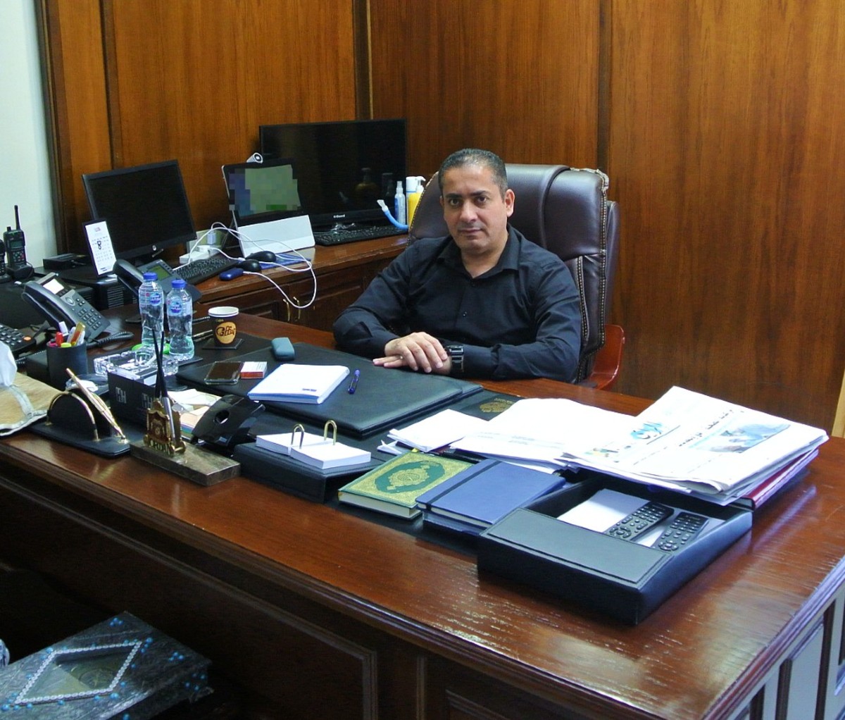 Jordanian man sitting at desk