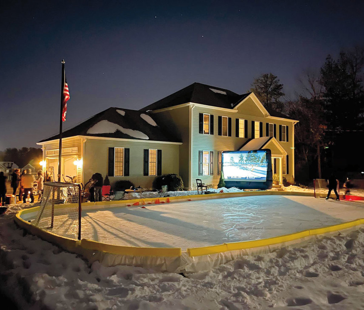 Outdoor home hockey rink at night