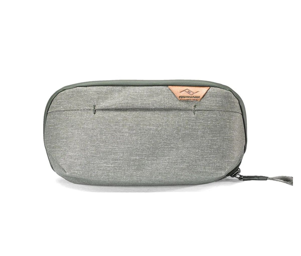 Small grey dopp kit on a white background.