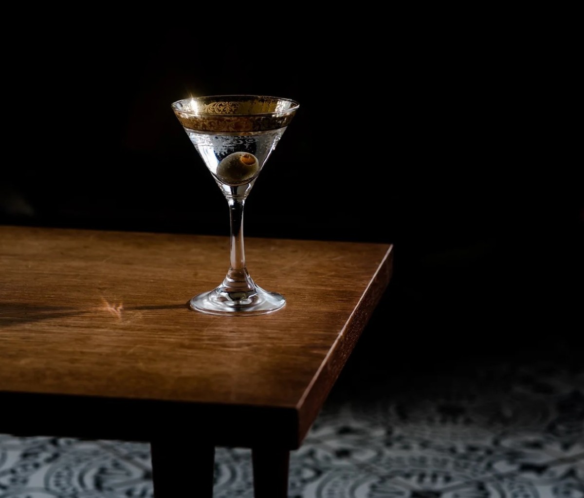 Martini on table with dark background